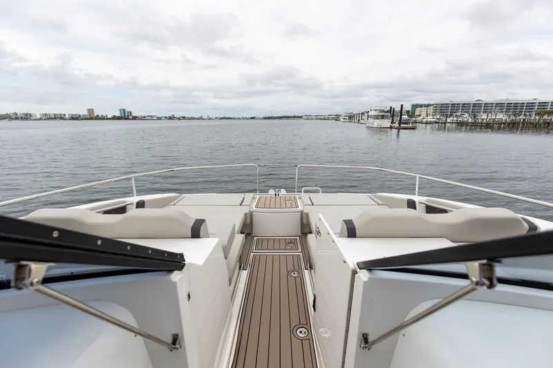  Yacht Photos Pics 2023 Aquila 36 Sport yacht deck with waterfront view, featuring sleek seating and modern design.