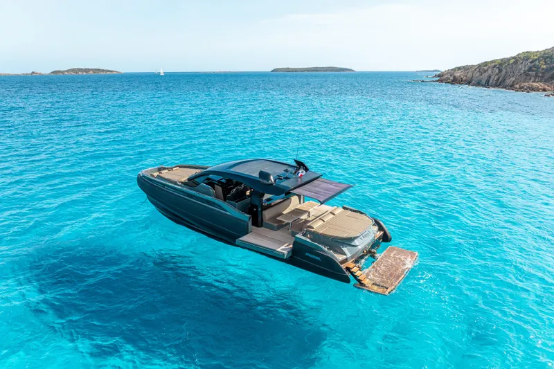 V-adeus Yacht Photos Pics 2024 SACS Rebel 55 yacht cruising in clear blue waters, showcasing luxury and elegance.