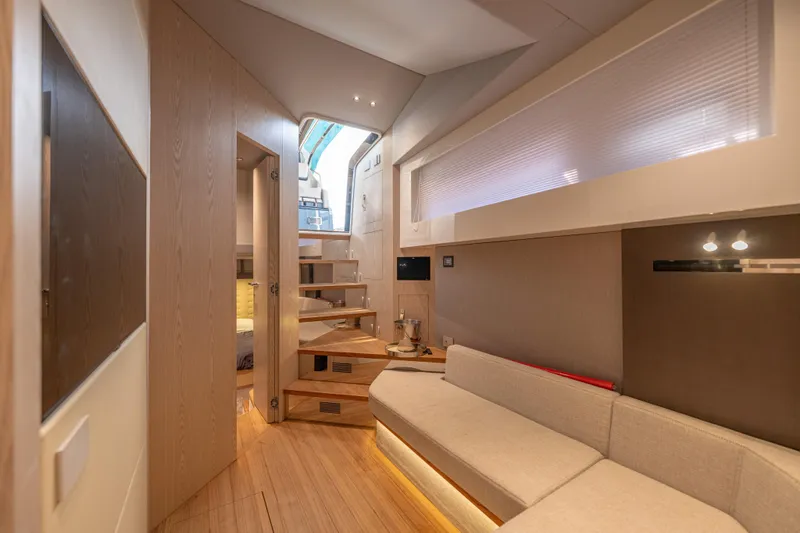 V-adeus Yacht Photos Pics Luxurious interior of 2024 SACS Rebel 55 yacht with modern design and cozy seating.