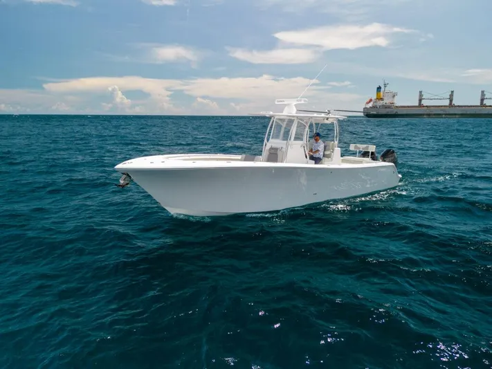  Yacht Photos Pics 2025 Front Runner 33 CC Custom boat cruising on open ocean waters.