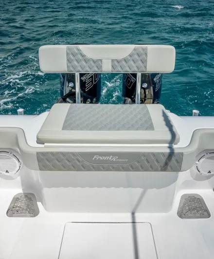  Yacht Photos Pics 2025 Front Runner 33 CC Custom boat, rear seating, ocean backdrop.