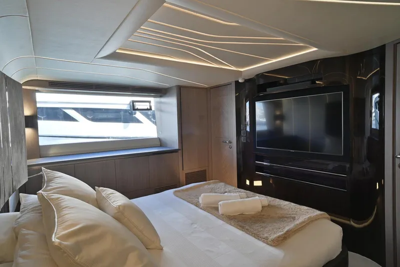  Yacht Photos Pics Luxurious bedroom interior of 2021 Galeon 680 Fly yacht with modern design and large window.
