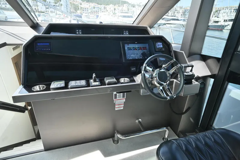  Yacht Photos Pics Helm of 2021 Galeon 680 Fly yacht with modern controls and navigation system.