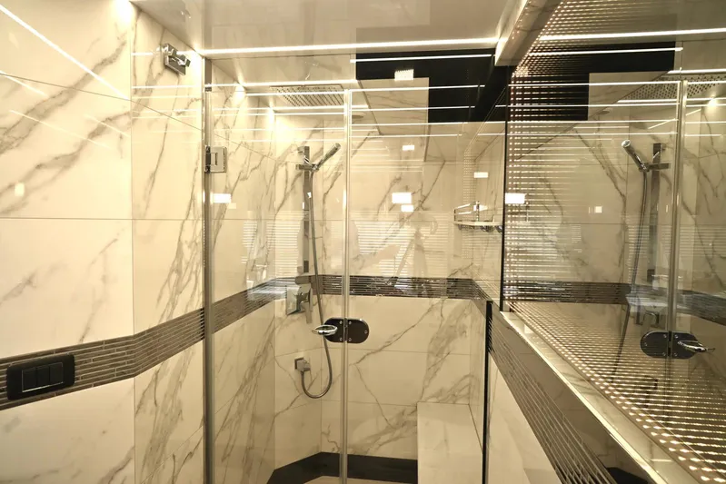  Yacht Photos Pics Luxurious bathroom with marble tiles in 2021 Galeon 680 Fly yacht.