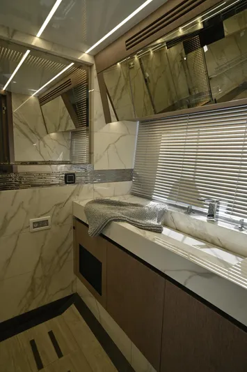  Yacht Photos Pics Luxurious bathroom in 2021 Galeon 680 Fly yacht with marble accents and modern fixtures.