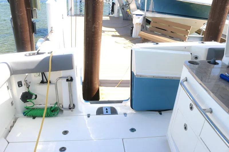  Yacht Photos Pics Boston Whaler 380 Outrage 2022 boat deck with seating and storage compartments.