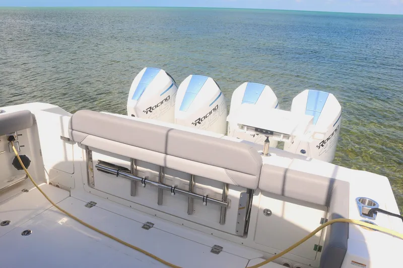  Yacht Photos Pics Boston Whaler 380 Outrage 2022 with powerful outboard engines on calm sea.