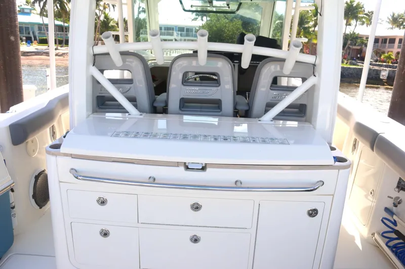 Yacht Photos Pics Boston Whaler 380 Outrage 2022 boat interior with seating and storage compartments.