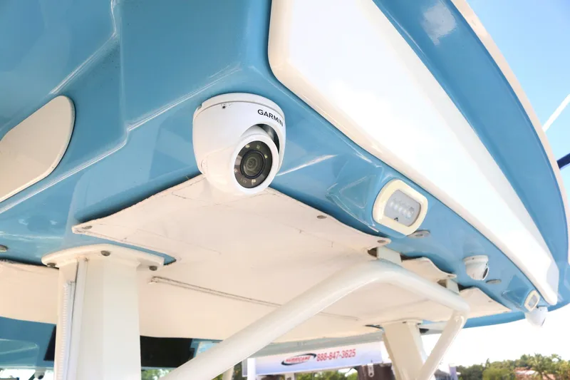  Yacht Photos Pics Boston Whaler 380 Outrage 2022, featuring a mounted Garmin camera on the blue hull.