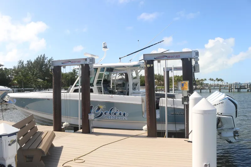  Yacht Photos Pics Boston Whaler 380 Outrage 2022 docked at a sunny marina.