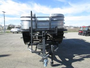 2024 Regency 230 DL3 pontoon boat on a trailer, front view.