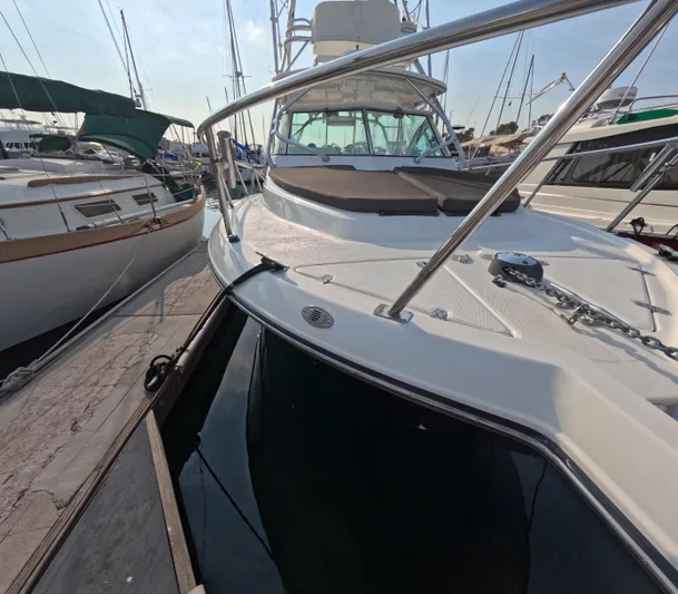 Alibi Yacht Photos Pics 2006 Rampage Express Offshore Tower boat docked at marina.