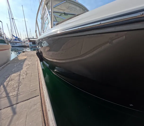 Alibi Yacht Photos Pics 2006 Rampage Express Offshore Tower boat docked at marina.