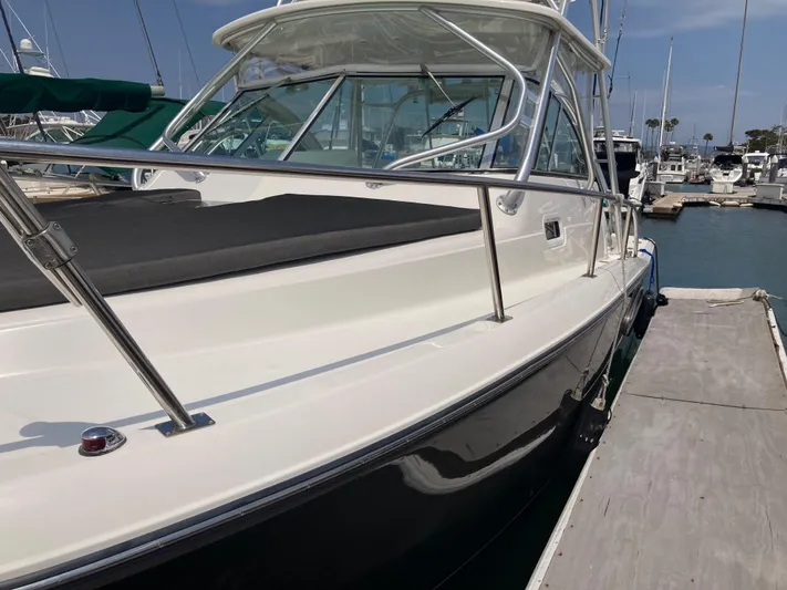 Alibi Yacht Photos Pics 2006 Rampage Express Offshore Tower boat docked at marina.