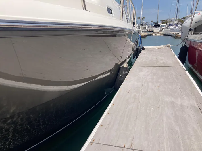 Alibi Yacht Photos Pics 2006 Rampage Express Offshore Tower yacht docked at marina.