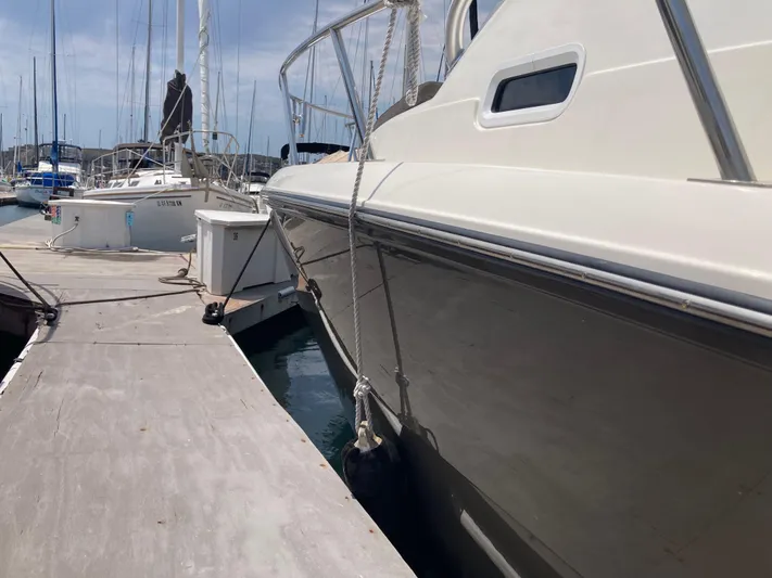 Alibi Yacht Photos Pics 2006 Rampage Express Offshore Tower yacht docked at marina.