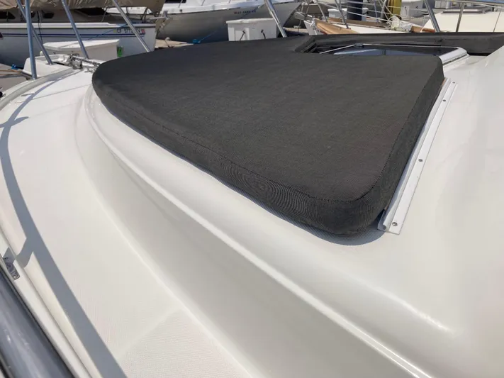 Alibi Yacht Photos Pics 2006 Rampage Express Offshore Tower boat with cushioned deck area.