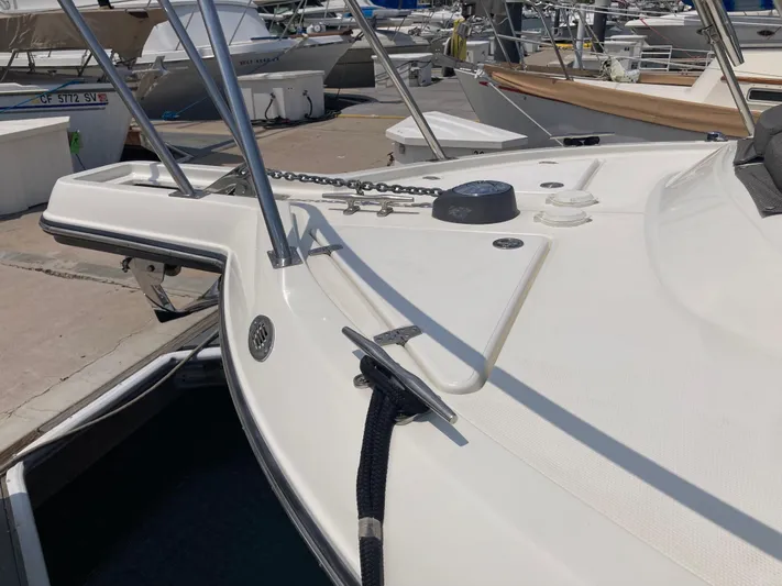 Alibi Yacht Photos Pics 2006 Rampage Express Offshore Tower boat docked at marina, showing deck and railing details.