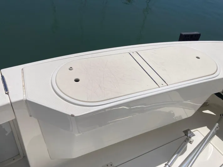 Alibi Yacht Photos Pics 2006 Rampage Express Offshore Tower boat deck with storage compartment.