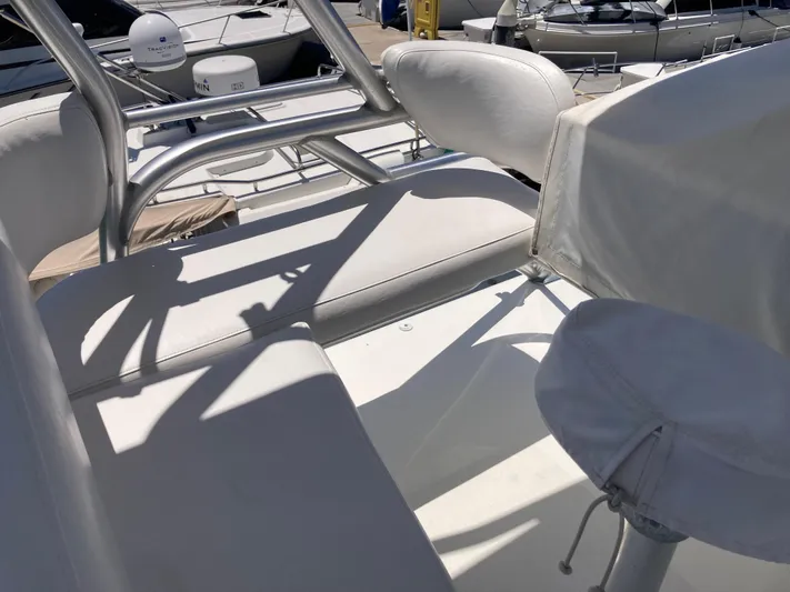 Alibi Yacht Photos Pics 2006 Rampage Express Offshore Tower boat interior with white seating and metal framework.