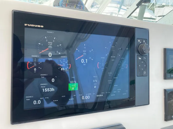 Alibi Yacht Photos Pics Furuno marine display on 2006 Rampage Express Offshore Tower showing engine and fuel data.