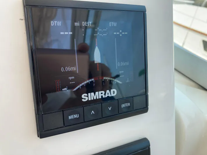 Alibi Yacht Photos Pics Simrad display on 2006 Rampage Express Offshore Tower boat, showing navigation data.