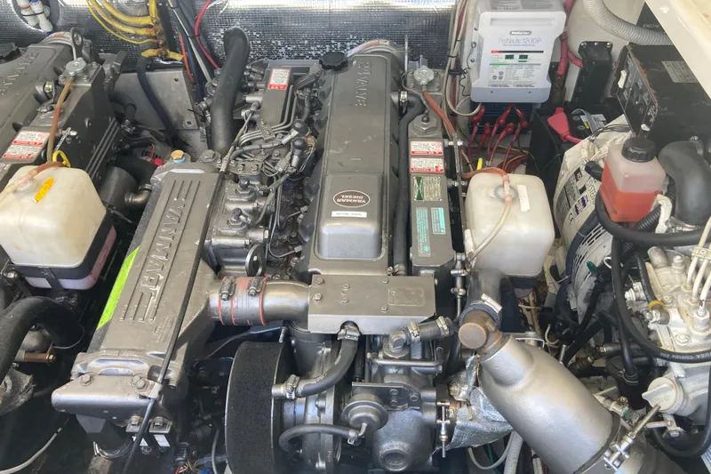 Alibi Yacht Photos Pics Engine room of 2006 Rampage Express Offshore Tower with Yanmar engines and electrical components.