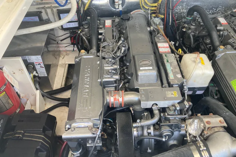 Alibi Yacht Photos Pics Engine room of a 2006 Rampage Express Offshore Tower boat, featuring Yanmar diesel engine.