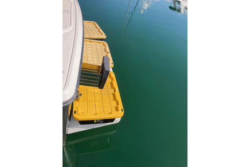 Alibi Yacht Photos Pics Yellow storage containers on a 2006 Rampage Express Offshore Tower boat.