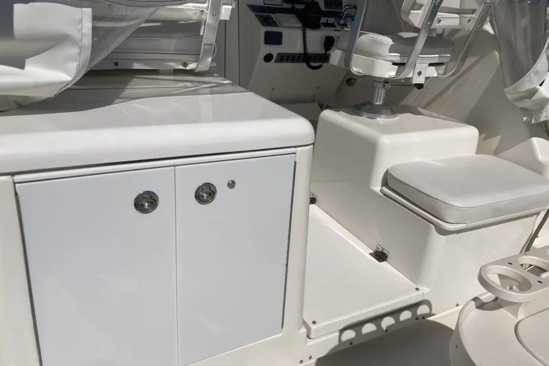 Alibi Yacht Photos Pics 2006 Rampage Express Offshore Tower boat interior with seating and storage.