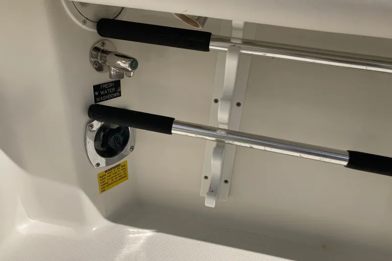 Alibi Yacht Photos Pics 2006 Rampage Express Offshore Tower fresh water washdown system with safety warning label.