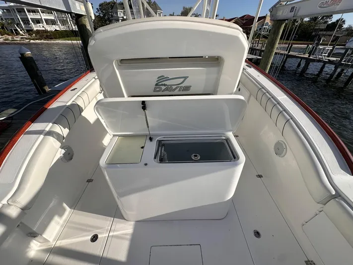  Yacht Photos Pics 2017 Buddy Davis 34 boat interior with open storage compartments, docked by the water.