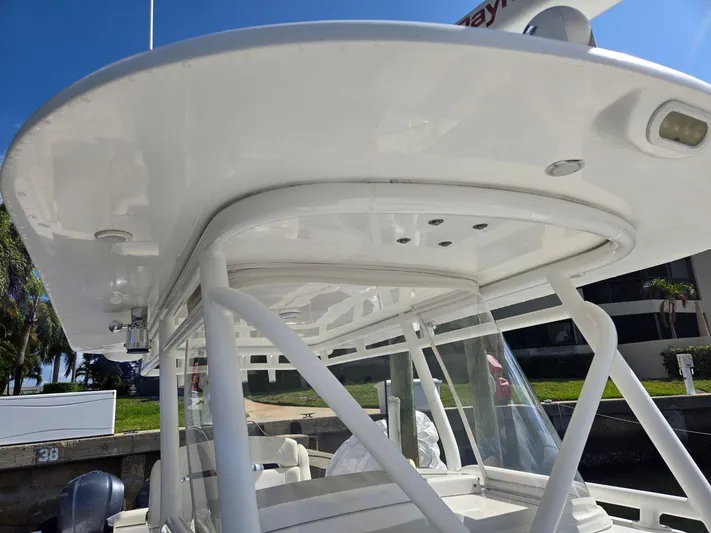  Yacht Photos Pics 2017 Buddy Davis 34 boat with sleek white hardtop and sturdy support structure.