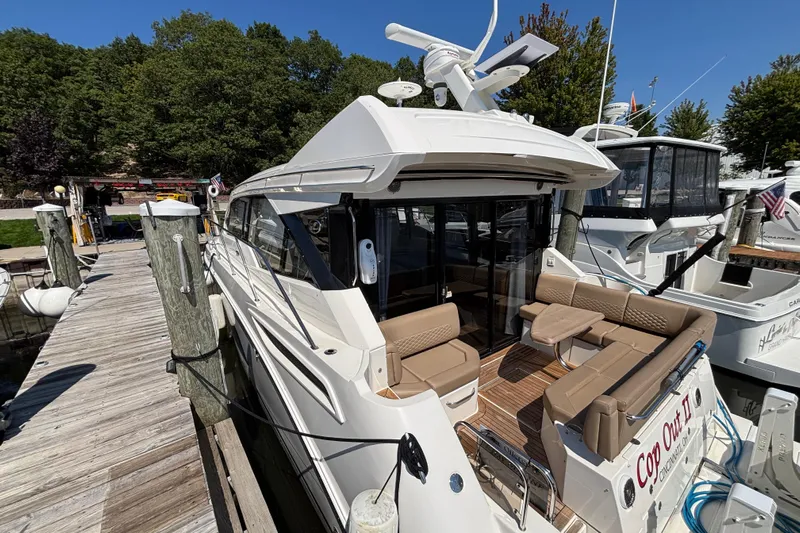 Cop Out II Yacht Photos Pics 2018 Sea Ray Sundancer 460 yacht docked, featuring spacious seating and sleek design.