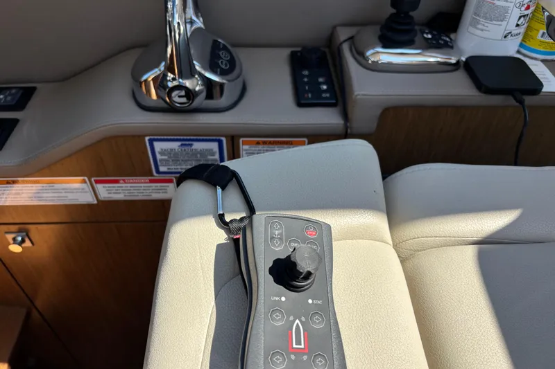 Cop Out II Yacht Photos Pics Control panel of a 2018 Sea Ray Sundancer 460 yacht, featuring joystick and throttle.