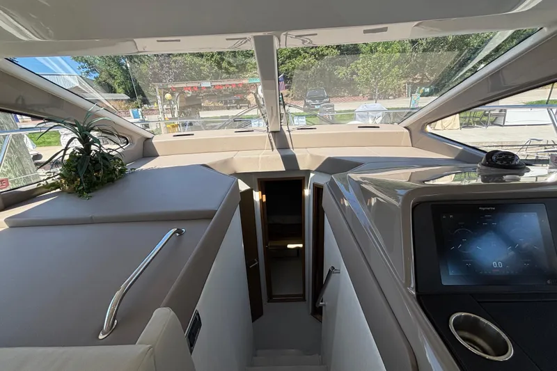 Cop Out II Yacht Photos Pics Interior view of 2018 Sea Ray Sundancer 460 yacht, featuring modern dashboard and sleek design.