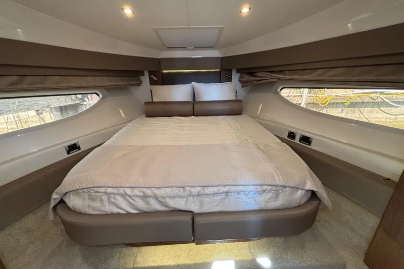 Cop Out II Yacht Photos Pics Luxurious cabin interior of 2018 Sea Ray Sundancer 460 yacht with cozy bed and ambient lighting.