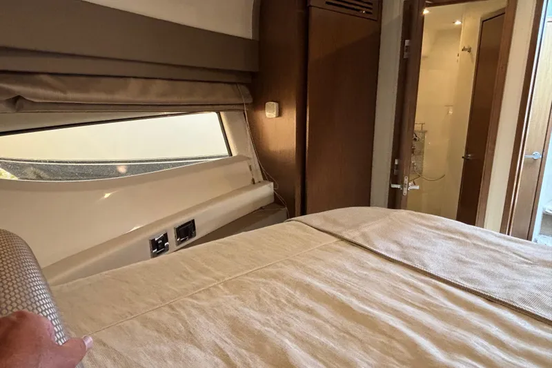 Cop Out II Yacht Photos Pics Interior cabin of 2018 Sea Ray Sundancer 460 yacht with bed and bathroom view.