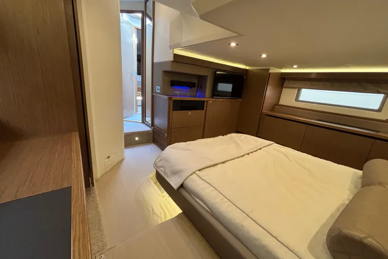 Cop Out II Yacht Photos Pics Luxurious interior of 2018 Sea Ray Sundancer 460 yacht, featuring a cozy bedroom.