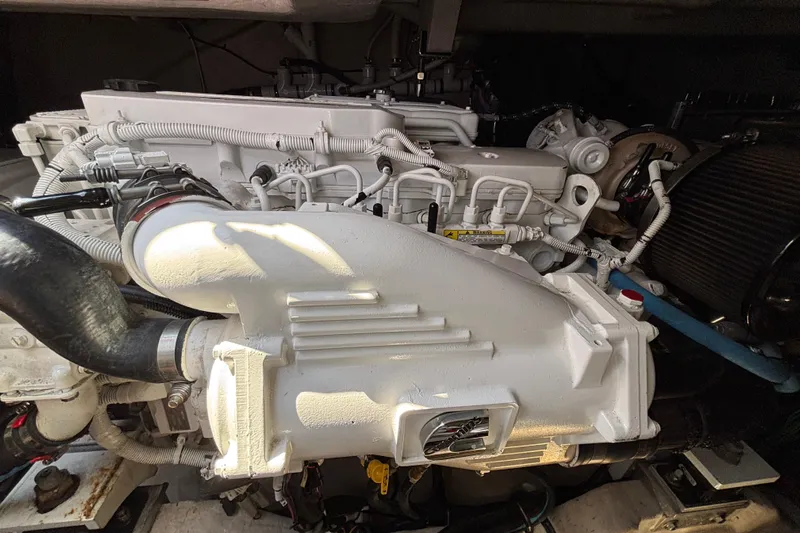 Cop Out II Yacht Photos Pics Engine of a 2018 Sea Ray Sundancer 460 yacht, showcasing intricate mechanical details.