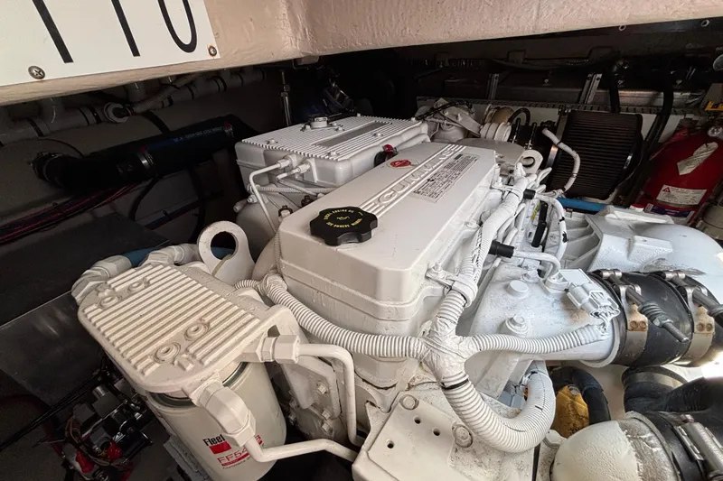 Cop Out II Yacht Photos Pics Engine room of 2018 Sea Ray Sundancer 460 yacht, featuring Cummins engine components.