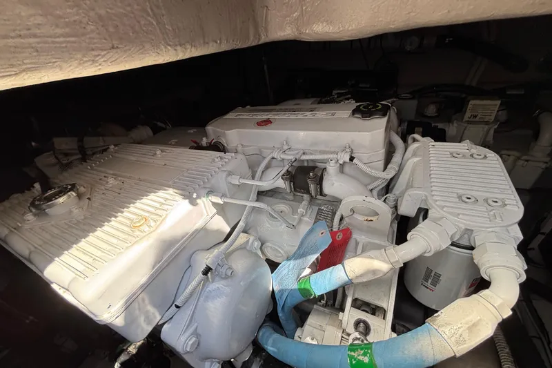 Cop Out II Yacht Photos Pics Engine compartment of a 2018 Sea Ray Sundancer 460, showcasing detailed mechanical components.