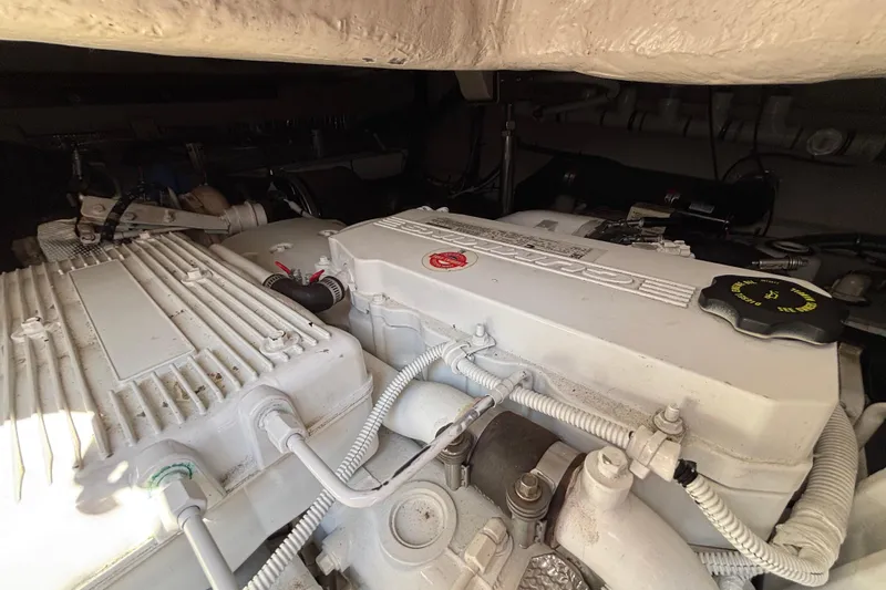 Cop Out II Yacht Photos Pics Engine compartment of 2018 Sea Ray Sundancer 460 yacht, showcasing detailed machinery.