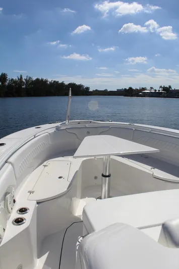  Yacht Photos Pics 2019 Edgewater 370CC boat on calm water under blue sky.