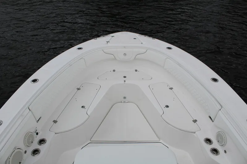  Yacht Photos Pics 2019 Edgewater 370CC boat bow with storage compartments on calm water.