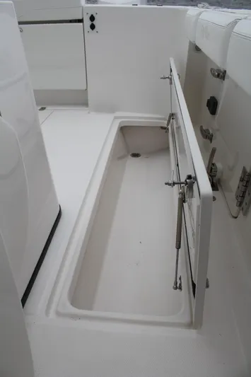  Yacht Photos Pics 2019 Edgewater 370CC boat storage compartment with open hatch, showcasing spacious interior.