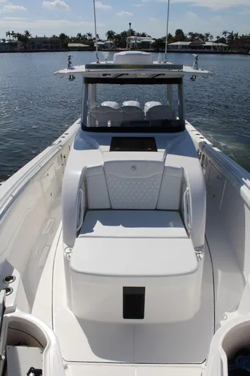  Yacht Photos Pics 2019 Edgewater 370CC boat on calm water, featuring sleek design and spacious seating.