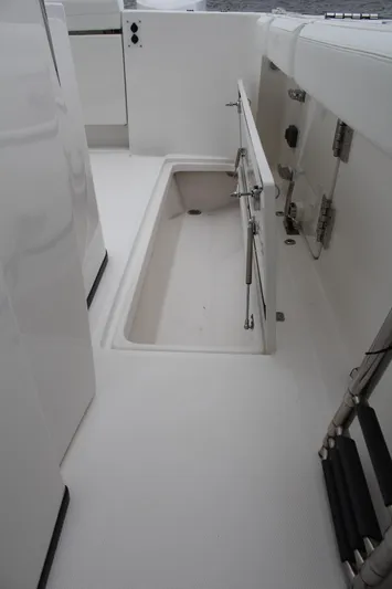  Yacht Photos Pics 2019 Edgewater 370CC boat interior with open storage compartment.