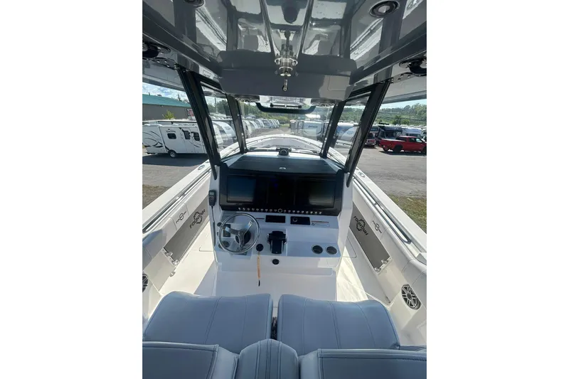  Yacht Photos Pics 2023 Fountain 38TE CC boat interior with modern helm and seating.