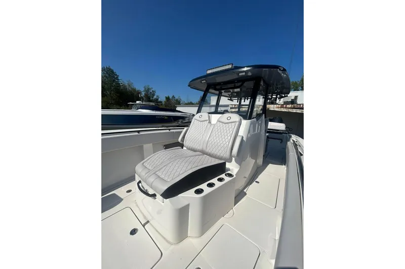  Yacht Photos Pics 2023 Fountain 38TE CC boat interior with luxurious seating and modern design.